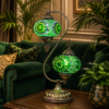 Handcrafted Turkish pink multicolor mosaic double globe table lamp on a wooden side table in a cozy living room.